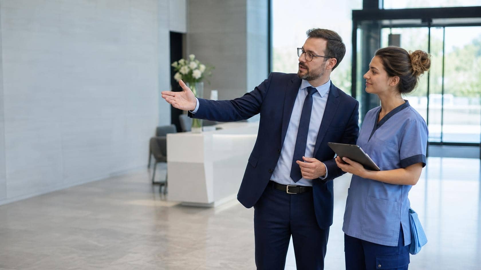 A Magic Hands cleaner discussing a cleaning program with a client