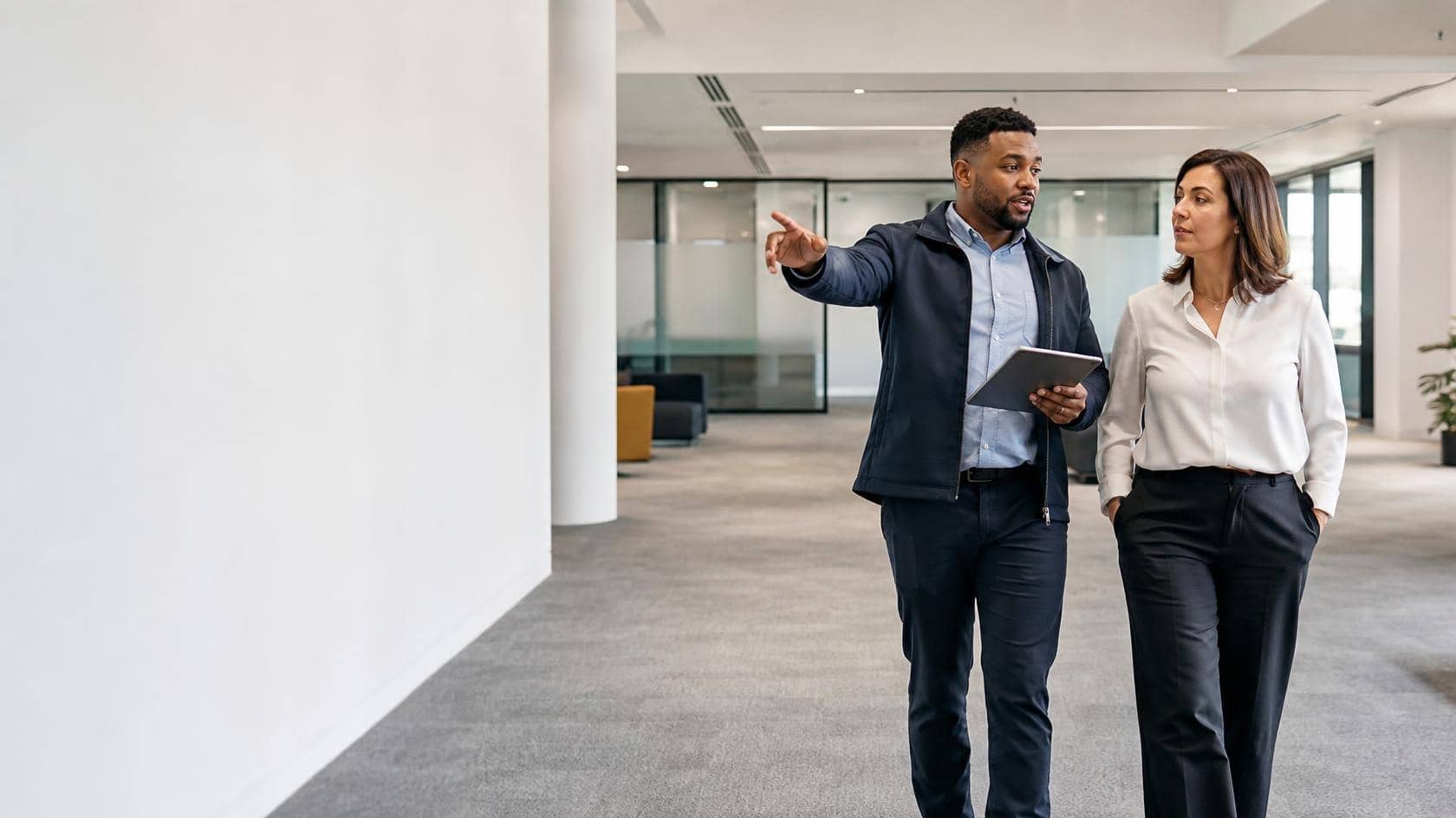 A Magic Hands supervisor walking a client through their premises during a site assessment